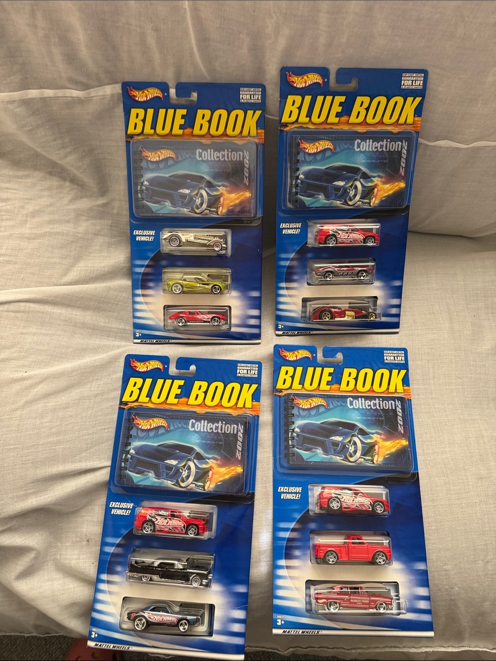 Hot Wheels Blue Book Collection Kids Toy Cars - Assorted Colors. Lot of 4